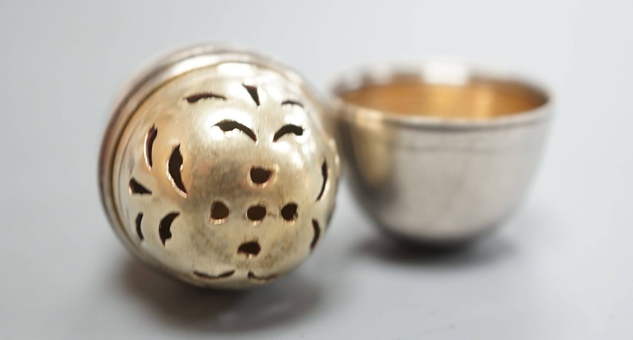 A George III silver egg shaped vinaigrette, by SM or WS, London, 1796, with engraved crest, 40mm.